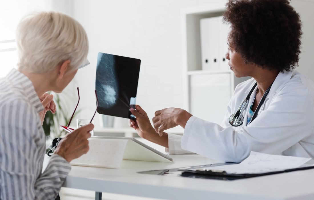 breast cancer doctor discussing results with patient on if cancer has returned